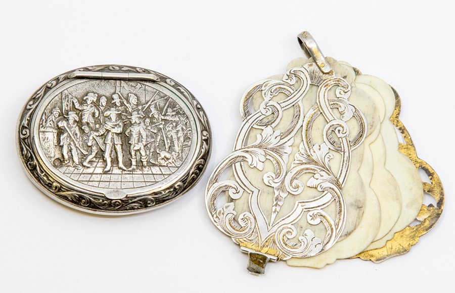 A 19th Century silver cartouche shaped Aide Memoire, openwork engraved body on suspension ring,