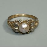 A Georgian style pearl and diamond unmarked gold ring, comprising a central pearl approx 6mm, with