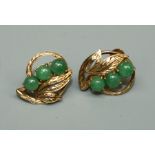A pair of jade set 14ct gold earrings, open leaf form, each set with three round cabochon jade