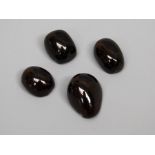 A collection of four cabochon garnets varying sizes, total carat weight approx 63carats