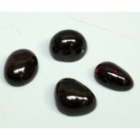 A collection of four cabochon garnets varying sizes, total carat weight approx 53.47ct