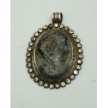 A Roman style silver Pendant, inset with steatite cameo depicting portrait with laurel wreath