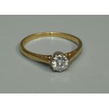 A diamond and 18ct gold solitaire ring, the claw set round brilliant cut diamond weighing approx 0.