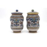 A pair of small Deruta maiolica albarello and covers, circa 1930, of typically waisted form and
