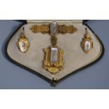 A Victorian Etruscan yellow metal revival demi parure, comprising a bar brooch, the top with applied