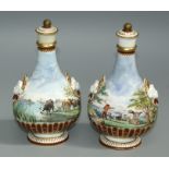 A pair of 19th century Continental porcelain flasks and covers of bellied form, each decorated