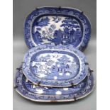 A pair of 19th century blue and white willow pattern meat platters, 35 x 45cm, together with another