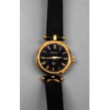 A lady's Gucci black and gilt metal dress watch, with quartz movement, 17mm dial on a Gucci
