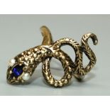 A synthetic sapphire and pearl set 14ct gold serpent ring, the head set with an oval synthetic