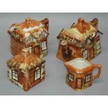 A Cottageware pottery teaset comprising a teapot decorated in browns, yellow and green in the