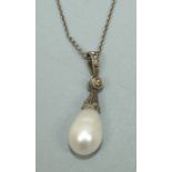 A cultured pearl and white gold pendant, comprising a pear shaped white pearl, approx 12 x 8mm, with