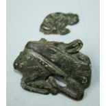 A Scythian bronze Brooch of a Stag, the head turned backwards to rest on its back with scrolled