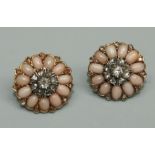 A pair of blush/ angel coral and diamond set earrings, comprising a central diamond set floral