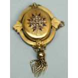 A Victorian Etruscan revival 18ct gold mourning brooch, the oval form set to the centre with a