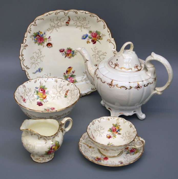 An Edwardian Coalport six setting tea service, hand coloured transfer decorated with floral