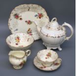 An Edwardian Coalport six setting tea service, hand coloured transfer decorated with floral