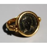 A Roman style coin set swivel ring, stamped 18k approx 8gm