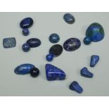 A collection of  cabochon and bead lapis lazuli stones, varying sizes and shapes, total gross weight