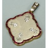 An early 20th Century ruby and diamond set unmarked yellow metal quatrefoil pendant locket, the