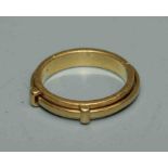 An 18ct gold 'spinning' ring, size N, stamped Asprey, made in Italy. 6gm