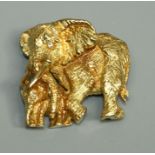 An 18ct gold  naturalistic brooch in the form an Elephant and calf, both set with diamond eyes, size