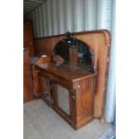 A late Victorian walnut chiffonier, having a mirrored back, 153cm high, 136cm wide, 47cm deep