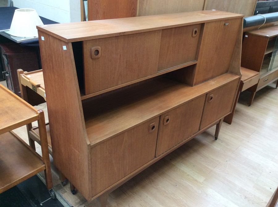 A Portwood teak 1970s side unit, two sliding doors to top, fold down cupboard, with two doors and
