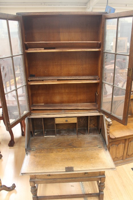 An early 20th Century oak bureau bookcase, fitted with two doors enclosing wooden shelves, the - Image 4 of 6