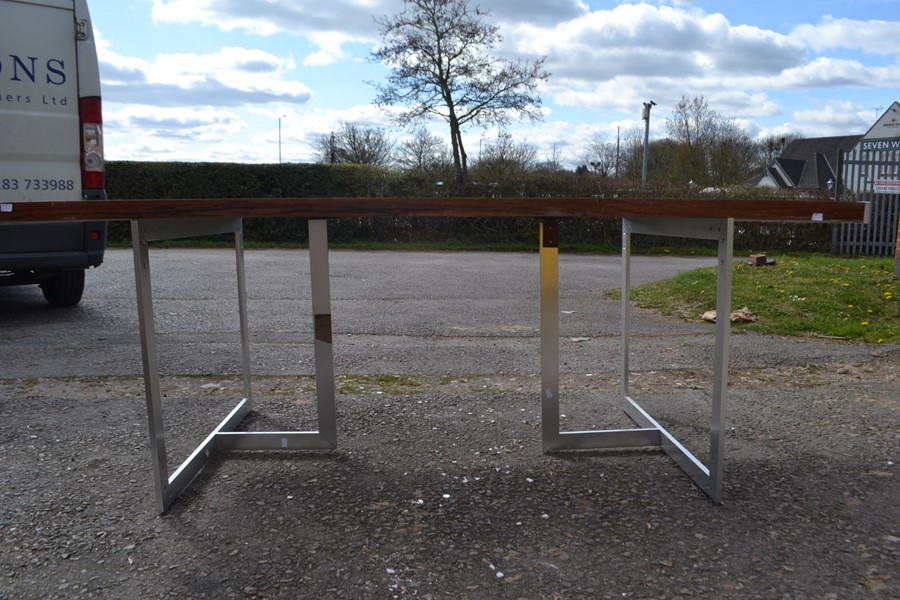 A Scandinavian rosewood refectory table raised on a pair of chrome tripod supports. 71cm H x 199cm W - Image 2 of 5