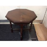 An early 20th Century mahogany octagonal occasional table, 57cm high, 61cm in diameter