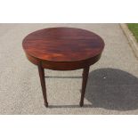 An early 19th Century mahogany fold-over tea table, boxwood banding, square tapered legs, 73cm