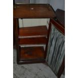 A late Victorian walnut music cabinet, single glazed door, brass gallery, 90cm high