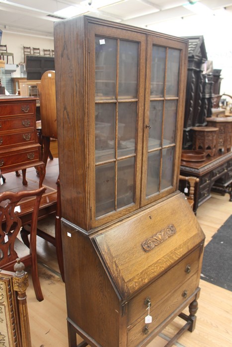 An early 20th Century oak bureau bookcase, fitted with two doors enclosing wooden shelves, the - Image 3 of 6