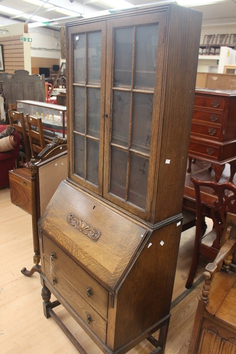 An early 20th Century oak bureau bookcase, fitted with two doors enclosing wooden shelves, the - Image 2 of 6