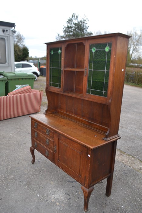 An Art Nouveau oak sideboard, circa 1910, with glazed upper section fitted with stained glass doors, - Image 2 of 3