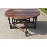 An early 18th Century joined oak gateleg table, fitted with two leaves, single drawer, 71cm high,