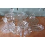 A large group of glassware, some moulded, some cut including comports, covered barrels, vases etc