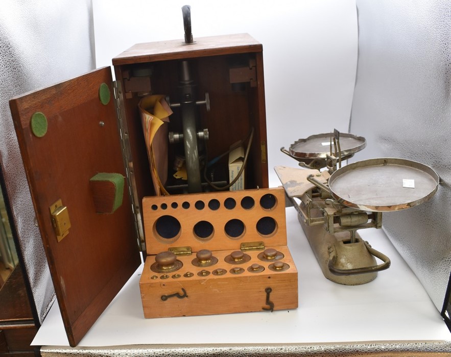 An A Baker 43843 London microscope (boxed) and a set of vintage scales with boxed weights (2)