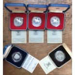 Five Royal Mint Silver Proof Crowns in Original  presentation cases with certificates.