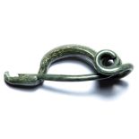 Iron age la Tene type i brooch of the 4th - 3rd century BC. The bronze brooch has a curved bow