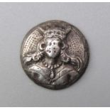 Silver Maidenhead Button.  Circa 17th century. Silver, 1.49g. 14.11 mm. A two piece silver button