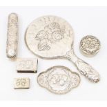 A collection of silver chased with Reynold's Angels decoration to include: shaped pin tray by
