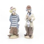 A Lladro Clown limited edition 'Little Traveller' stamped E-15 E and another Lladro Clown playing