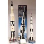 Revell model kit of Apollo Saturn V, in built condition, along with another smaller scale rocket.