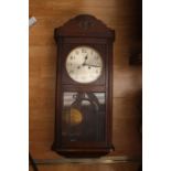 Early 20th century cased Singer sewing machine along with 1940s oak wall clock (2)