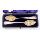 A matched pair of George III Scottish silver berry spoons, hallmarked in Edinburgh, 1809, one with