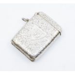 An Edwardian silver vesta case, rectangular form with engraved scroll and foliate decoration,