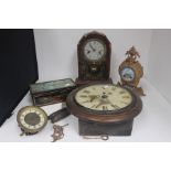 A collection of clocks to include an America mantle clock, gilt metal and porcelain mantle clock and