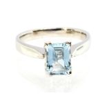 A aquamarine and platinum solitaire ring, comprising a rectangular cut aquamarine, size approx  8