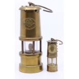 A small brass miners lamp, having a badge inscribed 'England' with a Tudor Rose, height approx. 24cm